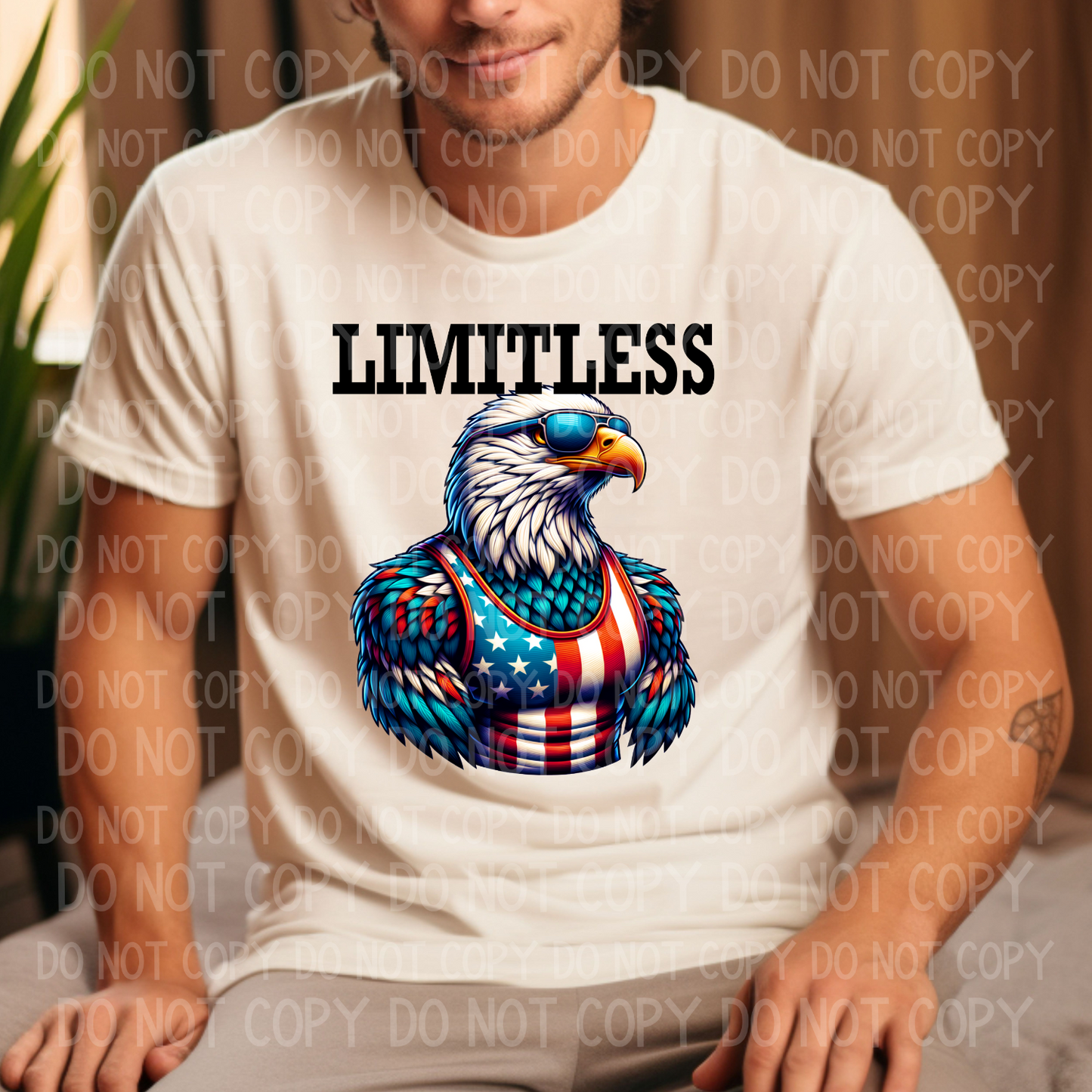 A person wearing a white unisex crew neck t-shirt with a graphic of an eagle and the text 'LIMITLESS' on the front.