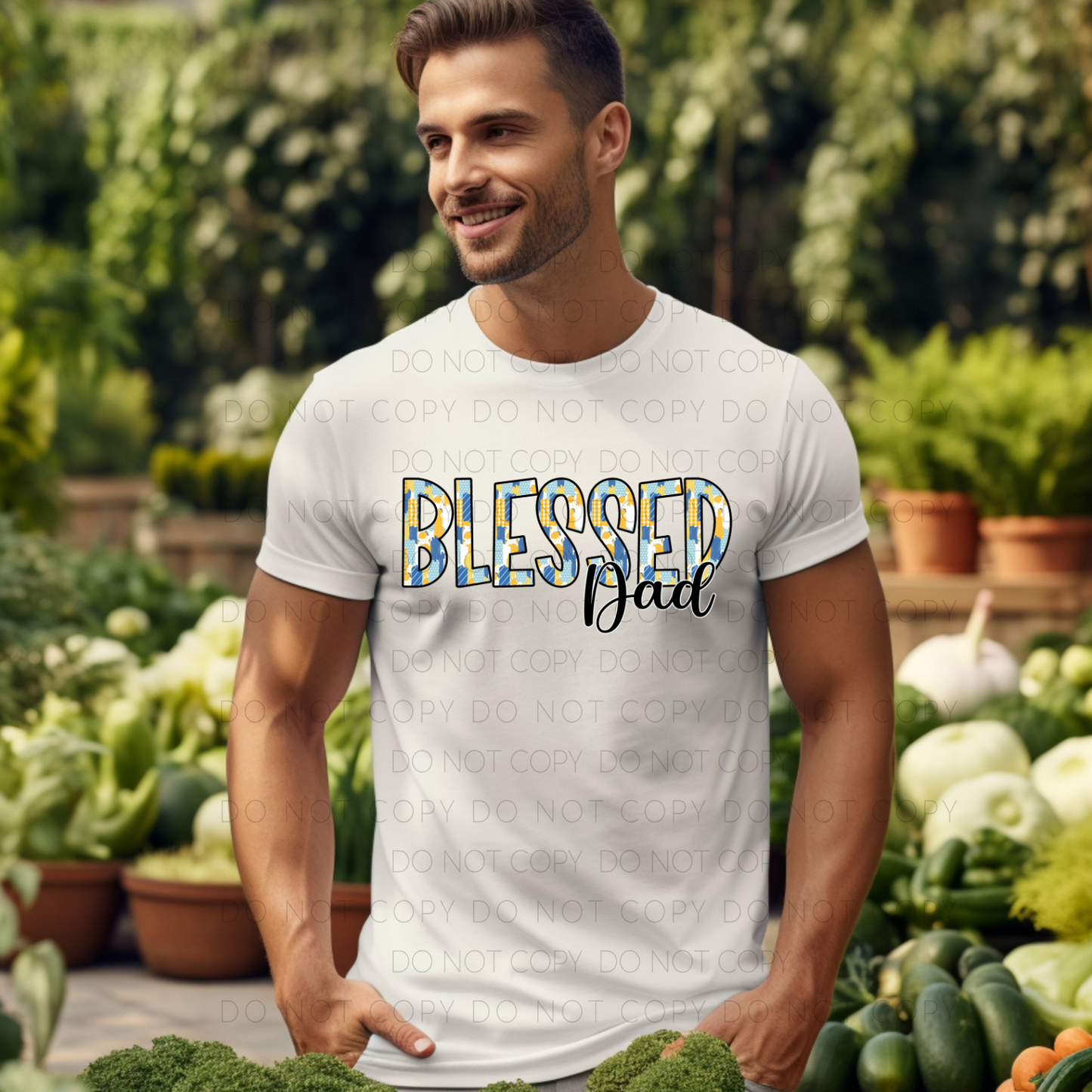 A man wearing a white crew neck t-shirt with the text 'Blessed Dad' printed in blue on the front.