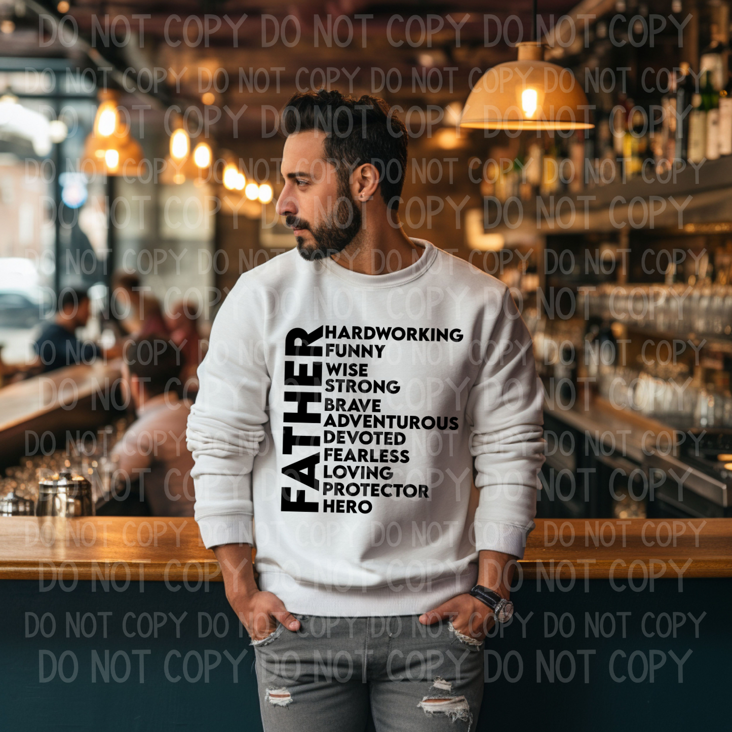 A man wearing a white unisex crewneck sweatshirt with the word 'FATHER' followed by various adjectives describing a father, such as 'Hardworking', 'Funny', 'Brave', 'Loving', and ' Protector'.