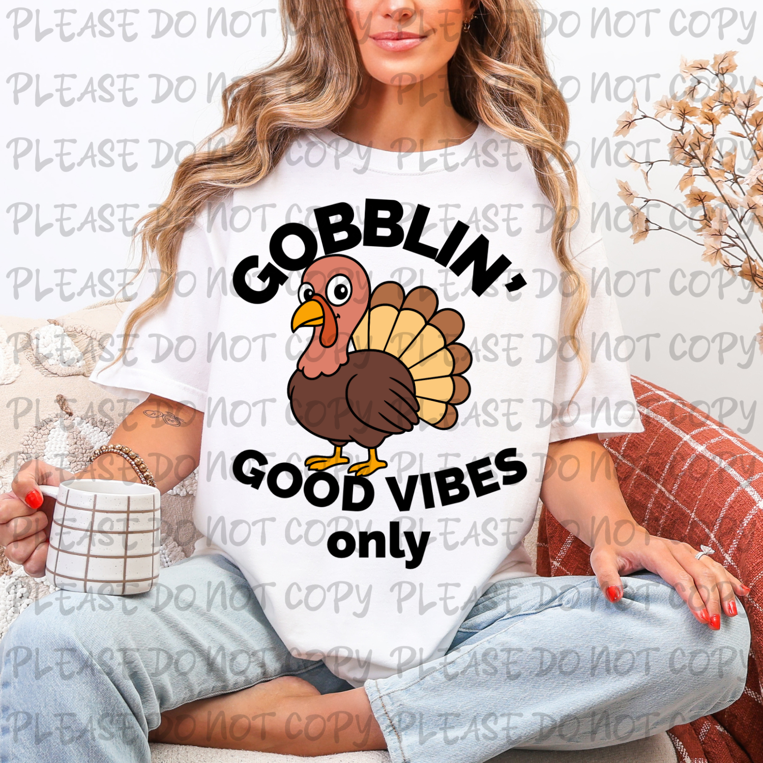 Person wearing a white t-shirt with a turkey graphic and text, holding a mug.